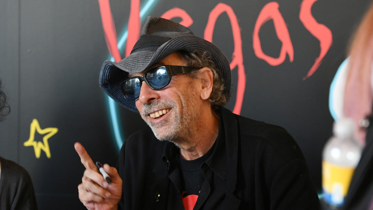 Tim Burton signs books at his exhibition “Lost Vegas: Tim Burton @ The Neon Museum" on October 15, 2019. (Photo by Denise Truscello/WireImage) 