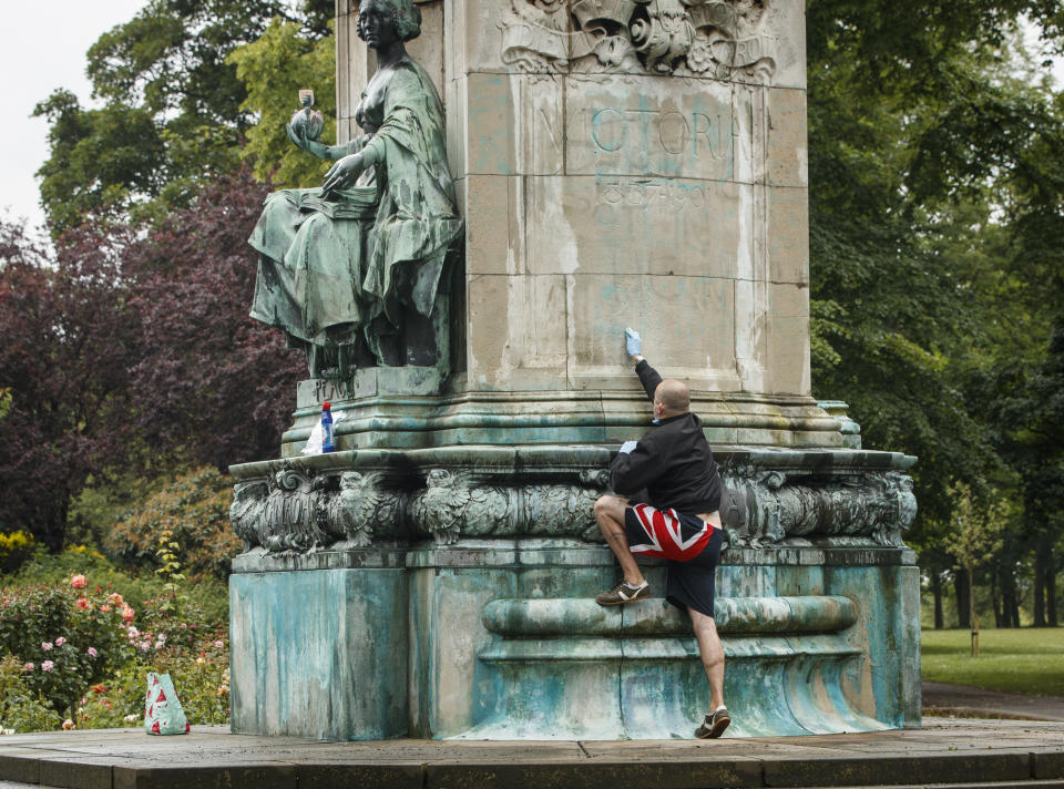 Member of the public Graham Newby cleans graffiti, that included the letters BLM and the words "murderer" and "slave owner", from a statue of Queen Victoria in Woodhouse Moor, Leeds, following a raft of Black Lives Matter protests that took place across the UK over the weekend. The protests were sparked by the death of George Floyd, who was killed on May 25 while in police custody in the US city of Minneapolis.