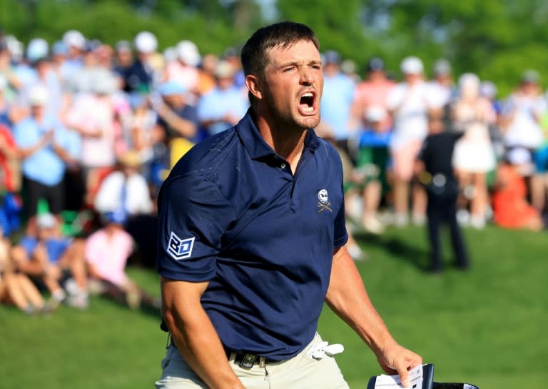 American Bryson DeChambeau roars after sinking a 10-foot birdie putt at the 18th hole to share the lead at the PGA Championship, although he would eventually lose by a stroke to Xander Schauffele (DAVID CANNON)