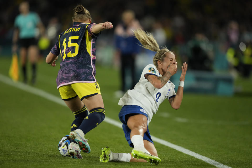 England's Rachel Daly is fouled by Colombia's Ana Guzman during the Women's World Cup quarterfinal soccer match between England and Colombia at Stadium Australia in Sydney, Australia, Saturday, Aug. 12, 2023. (AP Photo/Rick Rycroft)