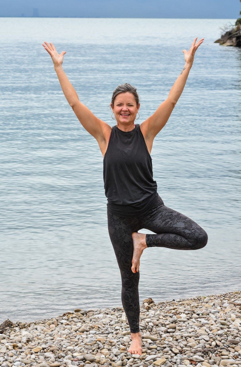 Jessica Karazsia, 200 RYT, practices yoga on the shores of Lake Erie at Catawba Island State Park on Sept. 25.