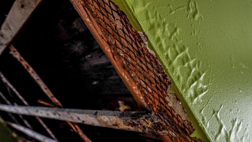 Bubbling paint and rotting wood, a sign of water damage during a tour of 1756 Esek Hopkins house.