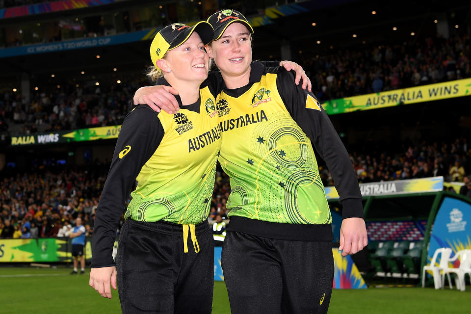 Alyssa Healy and Ellyse Perry smile after after winning the ICC Women's T20 Cricket World Cup Final.