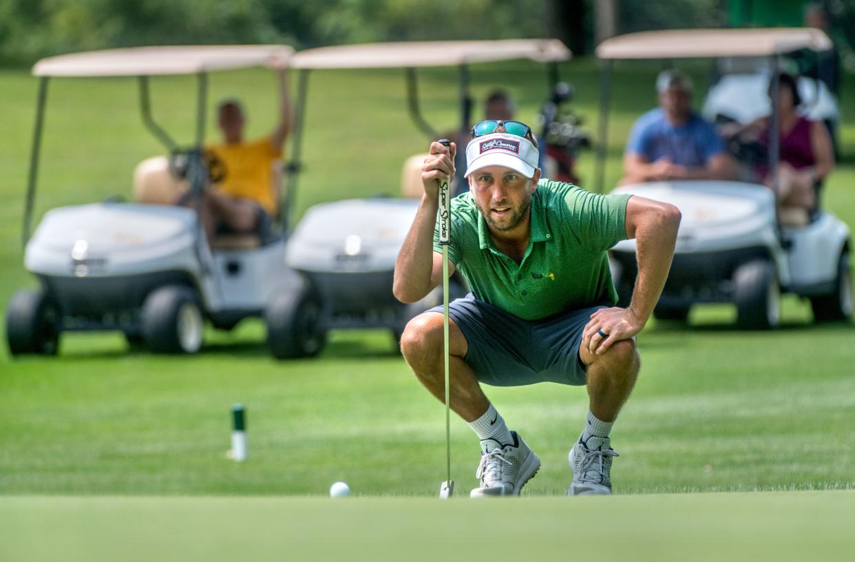 Ryan Julius lines up his putt on No. 9 during the Peoria Men's City Golf Championships on Saturday, Aug. 7, 2021 at Newman Golf Course.
