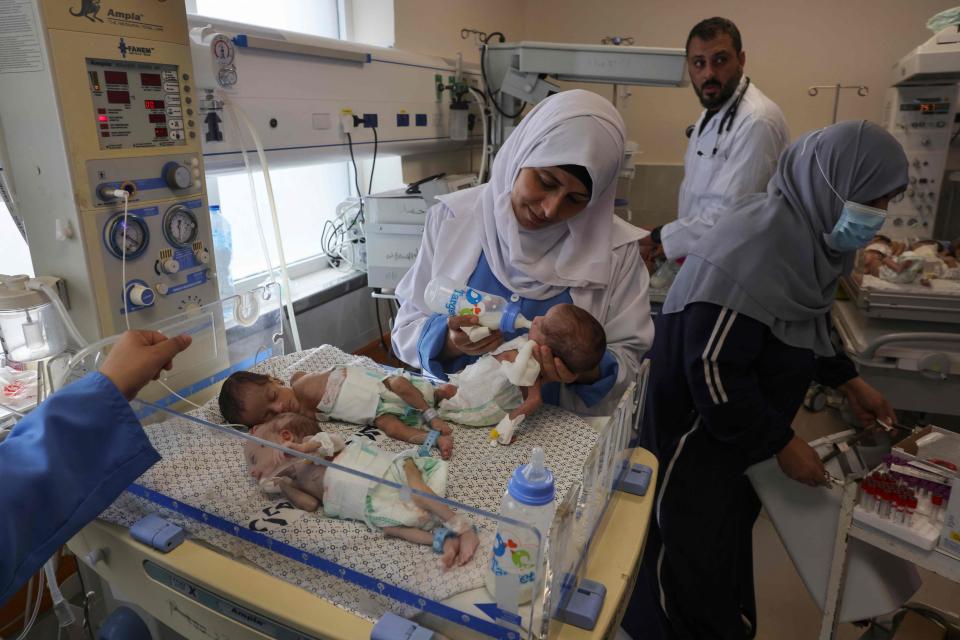 Palestinian medics care for premature babies evacuated from Al Shifa hospital to the Emirates hospital in Rafah in the southern Gaza Strip, on November 19, 2023.