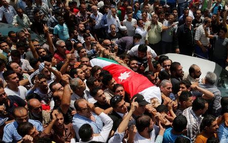 People attend the funeral of Mohammad Jawawdah in Amman, Jordan July 25, 2017. REUTERS/Muhammad Hamed