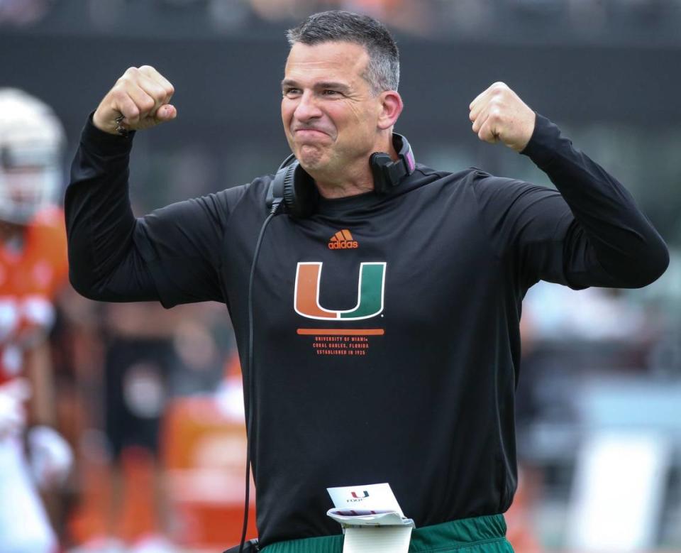 Miami Hurricanes head coach Mario Cristobal flexes during the spring game for the University of Miami at DRV PNK Stadium in Fort Lauderdale, Florida on Saturday, April 16, 2022.