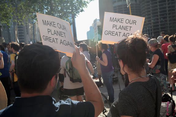 Demonstrators protest Trump's June 1 decision to exit the Paris Climate Agreement.