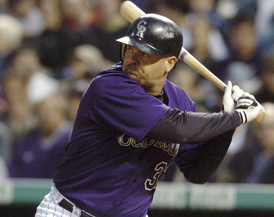 FILE - In this Wednesday, June 30, 2004 file photo, Colorado Rockies' Larry Walker gets ready to swing at a pitch from Milwaukee Brewers' Ben Sheets in the fourth inning of a baseball game in Denver. Derek Jeter came within one vote of being a unanimous pick for the Hall of Fame while Larry Walker also earned baseball's highest honor on Tuesday, Jan. 21, 2020 (AP Photo/David Zalubowski, File)