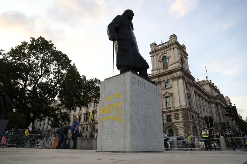 A graffiti is seen on the statue of Winston Churchill, in London