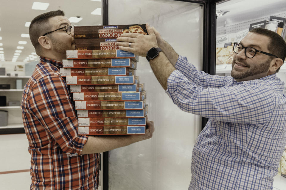 The pair hit up the frozen pizza section, too. (Photo: Erica Whiting Photography)