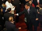 New Jersey Gov. Chris Christie shakes hands as he leaves a prayer service in celebration of his inauguration at the New Hope Baptist Church on Tuesday, Jan. 21, 2014 in Newark. The celebrations to mark the start of Christie's second term could be tempered by investigations into traffic tie-ups that appear to have been ordered by his staff for political retribution and an allegation that his administration linked Superstorm Sandy aid to approval for a real estate project. (AP Photo/Rich Schultz)