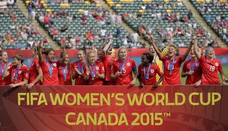 Jul 4, 2015; Edmonton, Alberta, CAN; England pose with their medals after their victory over Germany in the third place match of the FIFA 2015 Women's World Cup at Commonwealth Stadium. England defeated Germany 1-0 in extra time. Erich Schlegel-USA TODAY Sports