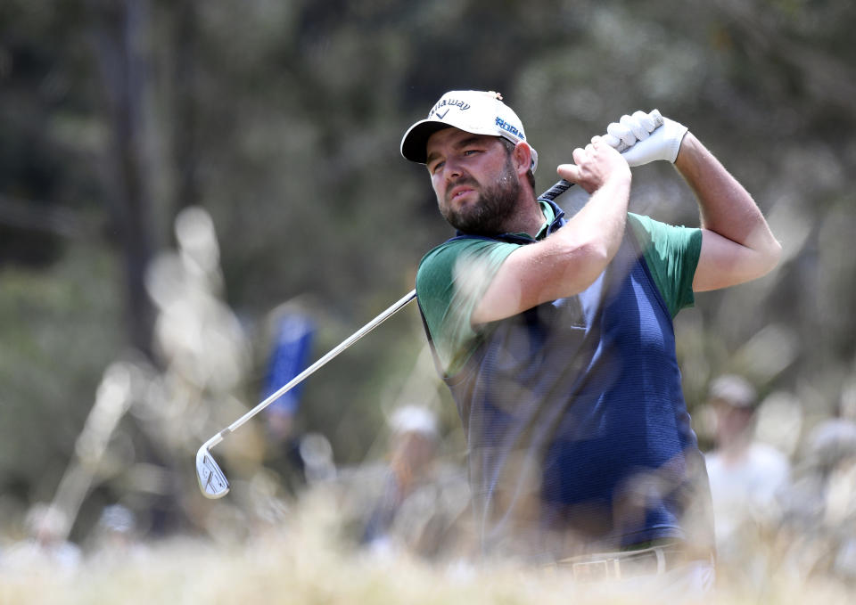 Australia's Marc Leishman hits an approach shot during the World Cup of Golf in Melbourne, Australia, Sunday, Nov. 25, 2018. (AP Photo/Andy Brownbill)