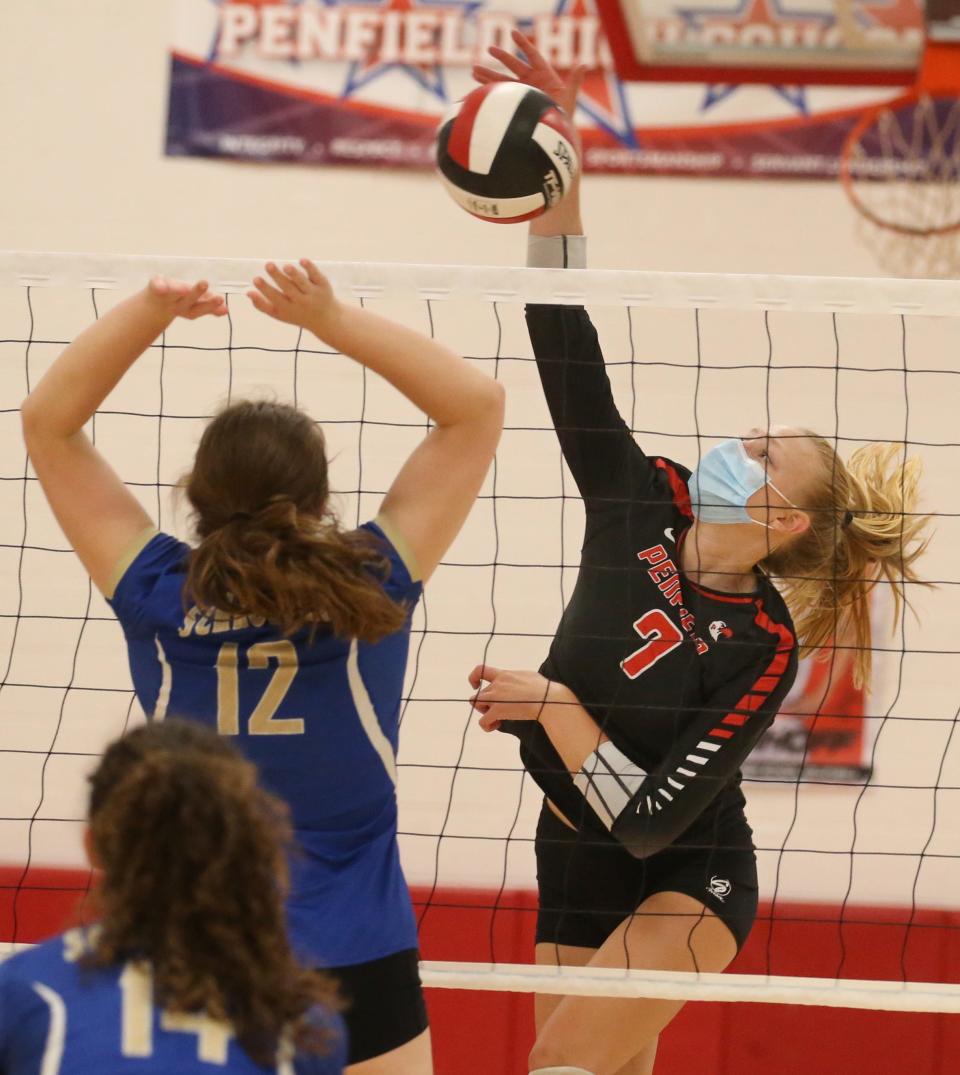 Penfield's Nicole Bell (7), right, sends a spike in for a point past Schroeder's Anna Dubay (12), left, during their matchup Wednesday, Oct. 6, 2021 at Penfield High.  Penfield won the contest 25-11, 25-14, 19-25, 25-8. 