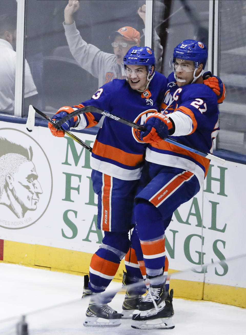 New York Islanders' Anders Lee (27) celebrates with Mathew Barzal after scoring a goal during the third period of the team's NHL hockey game against the Tampa Bay Lightning on Friday, Nov. 1, 2019, in Uniondale, N.Y. The Islanders won 5-2. (AP Photo/Frank Franklin II)