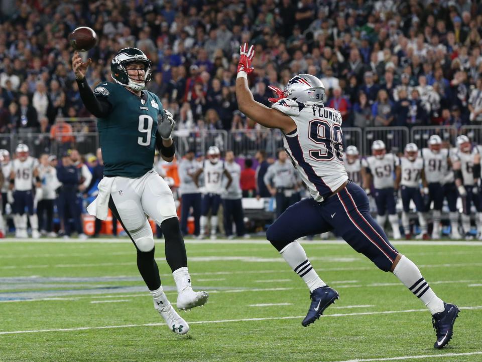 Nick Foles, throwing on the run against New England Patriots defensive end Trey Flowers, led the Philadelphia Eagles in Super Bowl LII.
