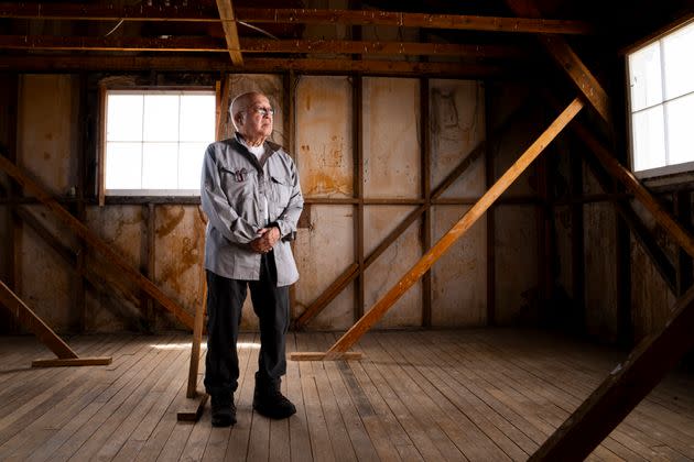 Paul Tomita poses for a portrait in a historic barracks at Minidoka National Historic Site, July 8, 2023, in Jerome, Idaho.
