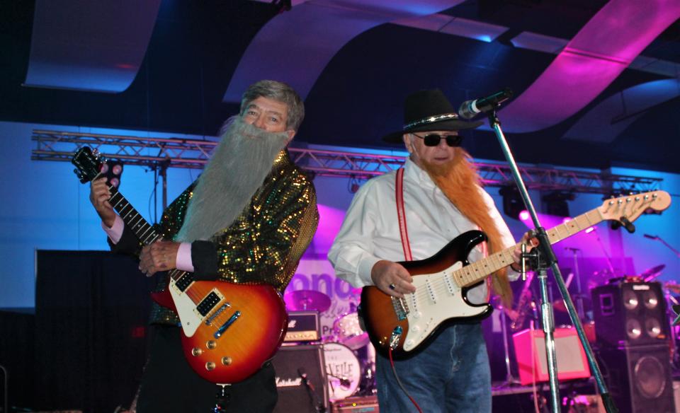 Joey Willoughby, left, and Frank Stroube, once members of the Abilene band Fabulous Furies, donned beards for a performance of "Sharp-Dressed Man" by ZZ Top at Garageband Woodstock in July 2019 at the Abilene Convention Center.