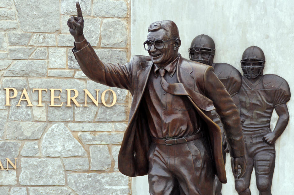 File-This July 12, 2020, shows the statue of former Penn State University head football coach Joe Paterno outside Beaver Stadium. Though the statue has been taken down, Penn State and the family of Paterno announced Friday, Feb. 21, 2020, they had resolved “the outstanding issues” that divided them, eight years after he was fired after Jerry Sandusky's child molestation arrest. The university and Paterno's widow, Sue Paterno, both issued statements that Penn State had agreed to pay “certain of the Paterno family's expenses” and wished to move forward. The amount was not disclosed. (AP Photo/Gene J. Puskar, File)