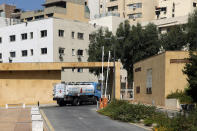 A tanker leaves after fueling the generator providing power to the UNESCO palace theater where parliament is meeting to confirm Lebanon's new government, so that people could observe social distancing measures, in Beirut, Lebanon, Monday, Sept. 20, 2021. A power outage and a broken generator delayed the start of the parliament session for some 40 minutes. (AP Photo / Bilal Hussein)