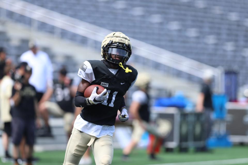 Army wide receiver Isaiah Alston runs with the football during Saturday's scrimmage at Michie Stadium.