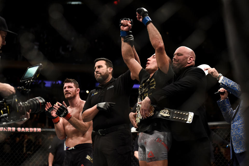 Georges St-Pierre celebrates his submission victory over Michael Bisping in their UFC middleweight championship bout during UFC 217 at Madison Square Garden on Nov. 4, 2017, in New York. (Getty Images)