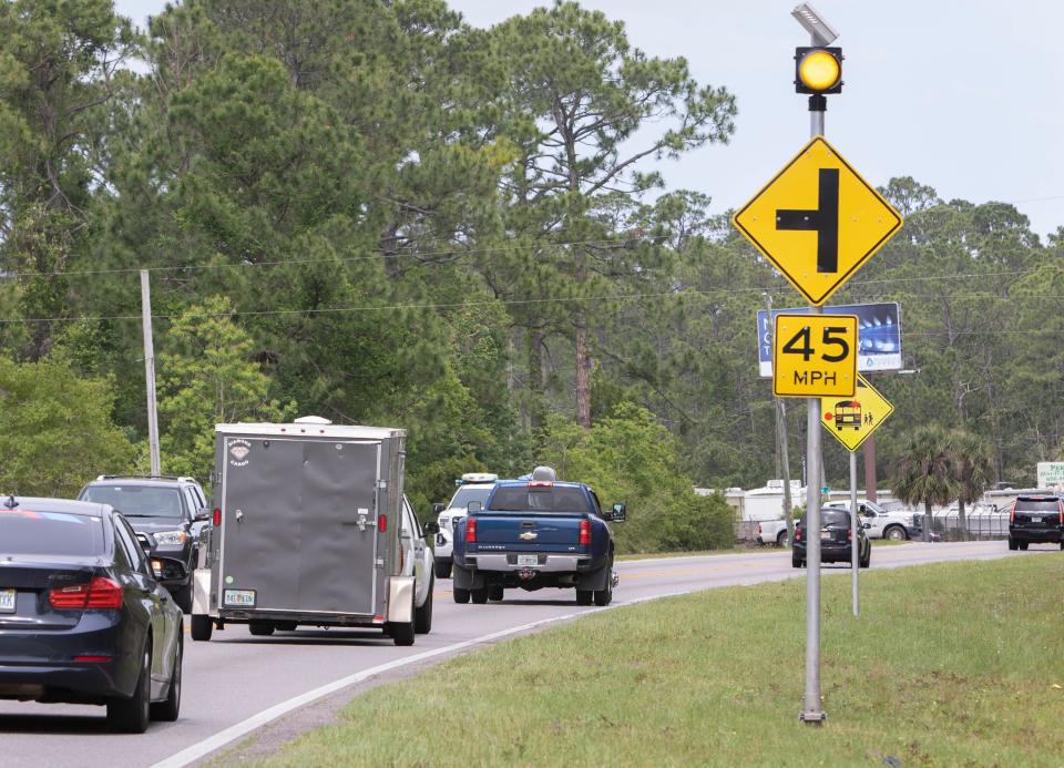 Traffic drives along Sorrento Road between Gulf Beach Highway and Blue Angels Parkway in Escambia County on April 20.