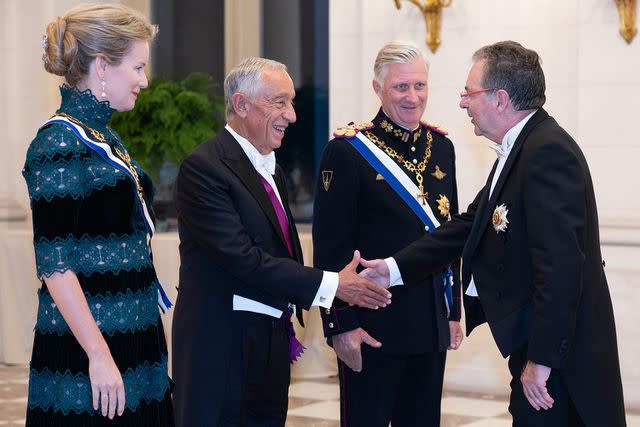 <p>BENOIT DOPPAGNE/Belga/AFP via Getty Images</p> Queen Mathilde of Belgium, President of Portugal Marcelo Rebelo de Sousa and King Philippe at Laeken Castle on October 17