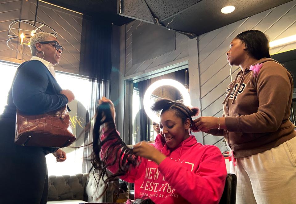 Asia Fadlelmula worked on her 17-year-old sister, London Jones, inside the Plush Wig Room, as her mother looked on. It will be prom soon.