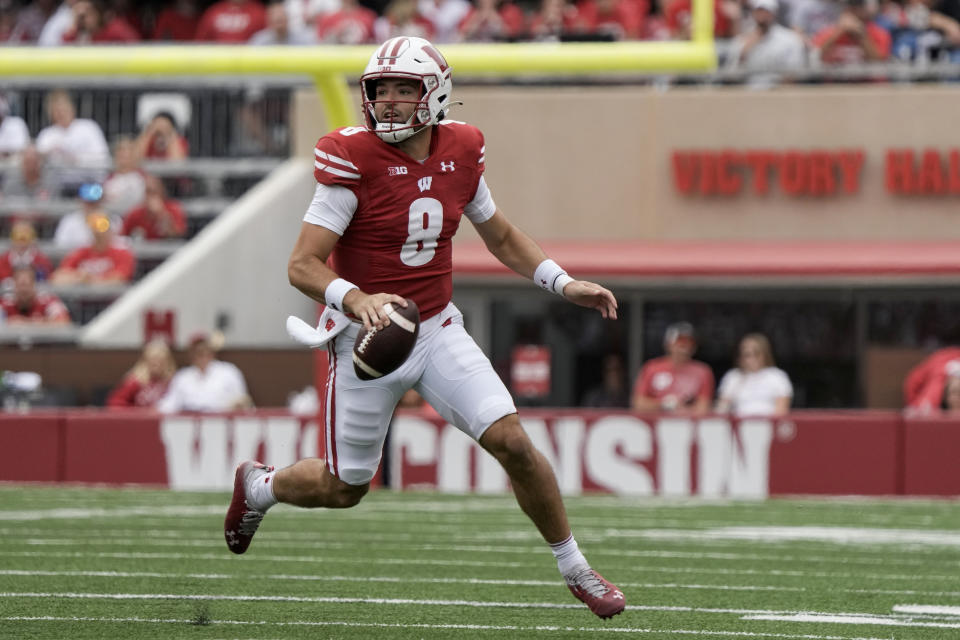 FILE - Wisconsin's Tanner Mordecai scrambles during the second half of the team's NCAA college football game against Georgia Southern, Sept. 16, 2023, in Madison, Wis. “I would much rather (play) on grass,” said Mordecai, who has played on turf for the Badgers and at SMU and on grass for Oklahoma. (AP Photo/Morry Gash, File)