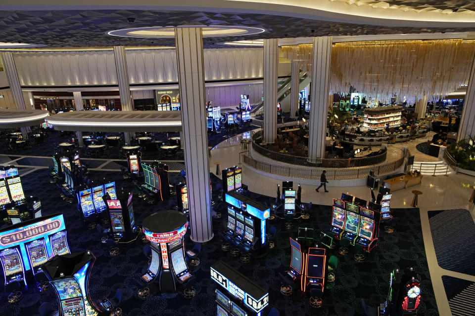 People walk through the casino area at the Fontainebleau Las Vegas hotel-casino Tuesday, Dec. 12, 2023, in Las Vegas. The property is scheduled to open Wednesday. (AP Photo/John Locher)