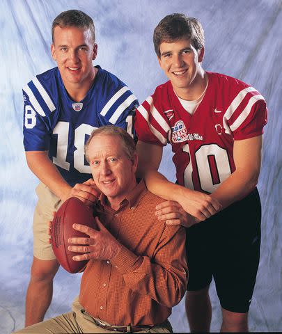 <p>Sporting News via Getty</p> Archie Manning, Peyton Manning and Eli Manning in 2004
