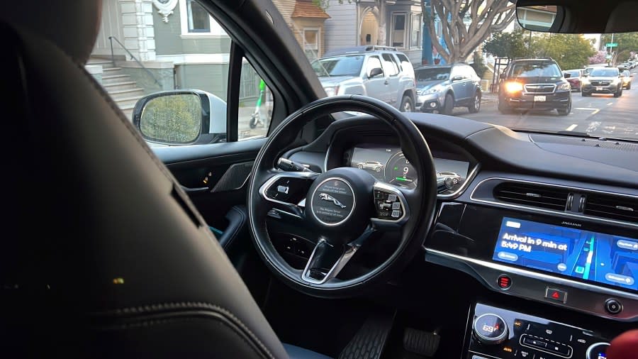 A Waymo driverless taxi drives on the street during a test ride in San Francisco, on Feb. 15, 2023. Cruise, a subsidiary of General Motors, and Waymo, a spinoff from Google, both are on the verge of operating 24-hour services that would transport passengers throughout one of the most densely populated U.S. cities in vehicles that will have no one sitting in the driver’s seat. (AP Photo/Terry Chea)