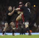 New Zealand's captain Richie McCaw (R) tackles Wales' Leigh Halfpenny during their Autumn International rugby union match at the Millennium Stadium in Cardiff, Wales, November 22, 2014. REUTERS/Rebecca Naden