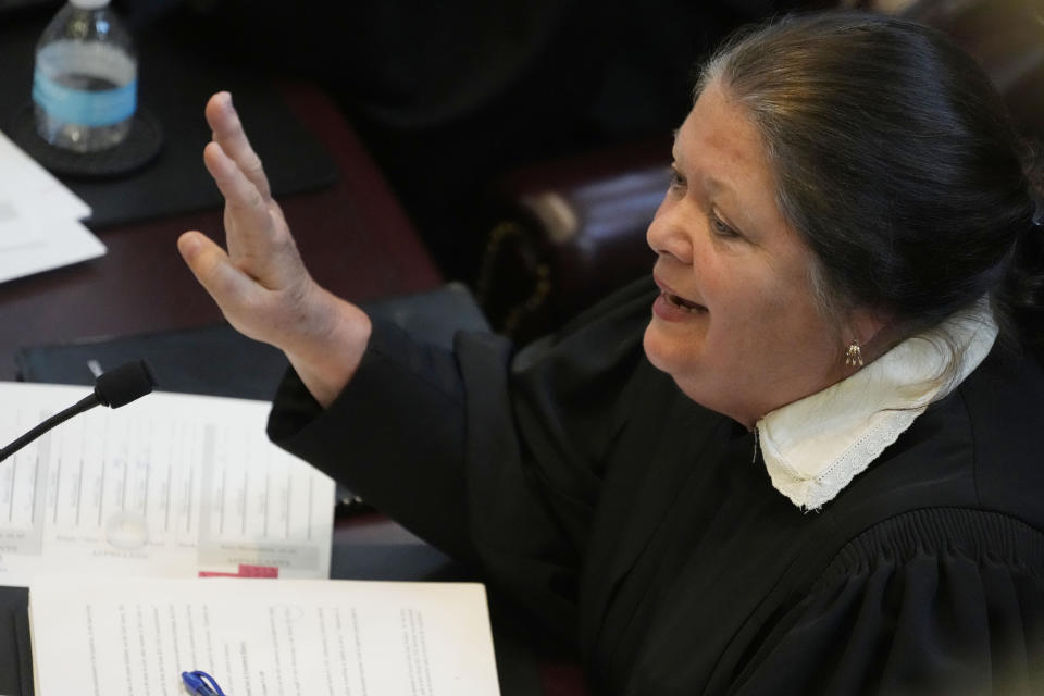 Mississippi Supreme Court Associate Justice Dawn Beam asks a question of lawyers during their arguments on the constitutionality of a Mississippi law that would authorize some judges who would be appointed in a state where most judges are elected, Thursday, July 6, 2023, before the state supreme court in Jackson, Miss. (AP Photo/Rogelio V. Solis)