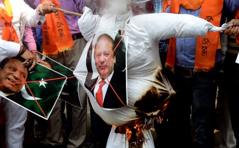 <p>Indian right-wing activists burn an effigy of Pakistan’s Prime Minister Nawaz Sharif during a protest against Pakistan, in New Delhi on September 19, 2016. India on September 19 weighed its response to a bloody raid on an army base in Kashmir which fuelled tensions with nuclear-armed Pakistan, as some politicians called for military action after the worst attack of its kind in over a decade. New Delhi has said that Pakistan-based militants were behind the September 18 attack in which 17 soldiers were killed, raising the prospect of a military escalation in the already tense disputed Himalayan region. </p>