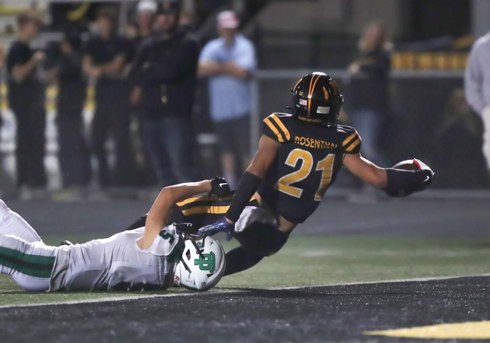 Newbury Park's Shane Rosenthal stretches for the end zone to score a touchdown during the Panthers' 54-42 regular-season win over rival Thousand Oaks on Sept. 22.