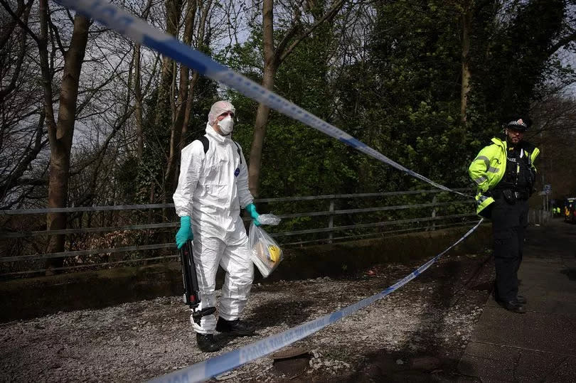 A forensics officer at the scence of the search in Kersal Dale