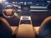 <p>Call us Luddites but we like that the Aviator’s cabin uses familiar, easy-to-use interfaces such as a single straightforward touchscreen and physical climate controls.</p>