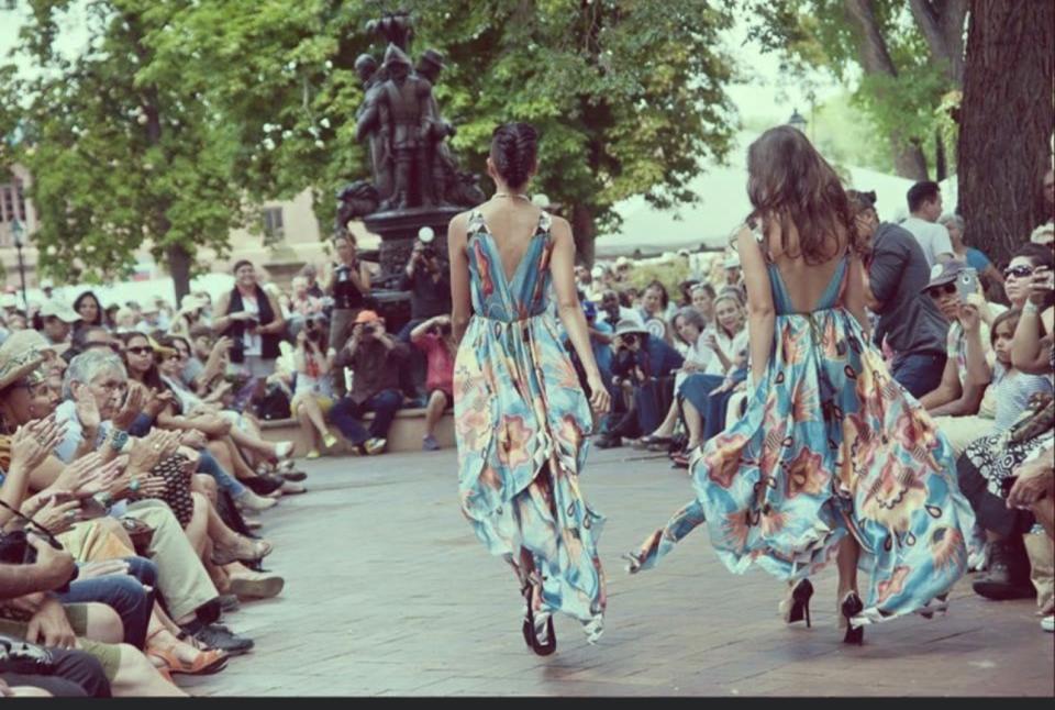 An early SWAIA contemporary fashion show featuring a Jamie Okuma runway look, held at Cathedral Park in Santa Fe, New Mexico.
