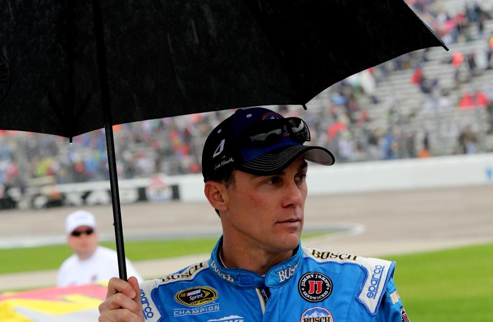 Rain fell on Kevin Harvick and others just before Sunday's race was set to start. (Getty)