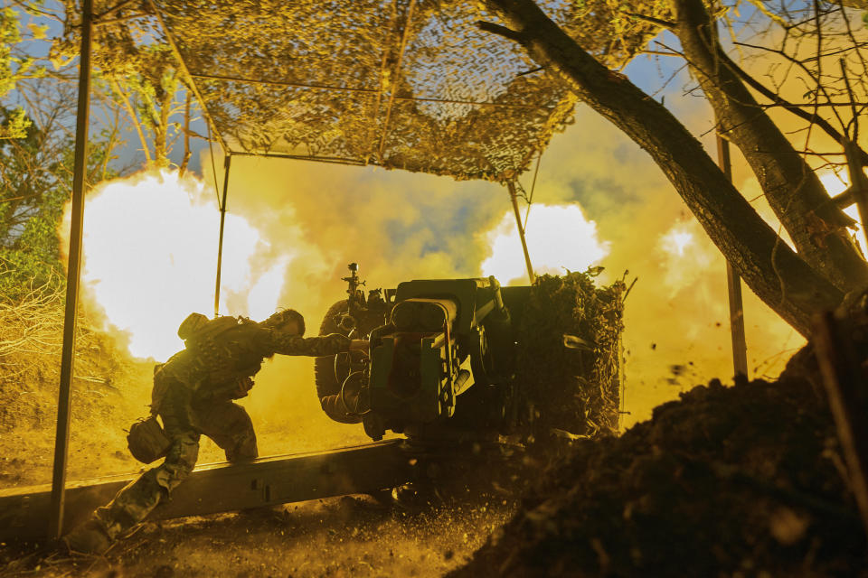 A Ukrainian serviceman firing a cannon