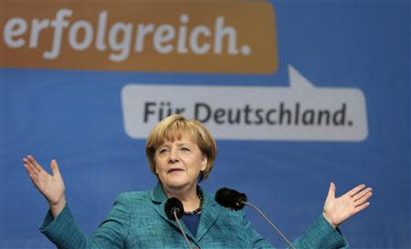 German Chancellor and head of the Christian Democratic Union party (CDU) Angela Merkel delivers a speech at a CDU election campaign event in Dresden September 15, 2013. REUTERS/Tobias Schwarz