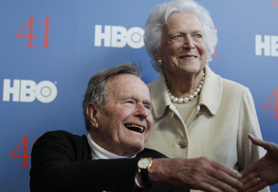 FILE - In a Tuesday, June 12, 2012 file photo, former President George H.W. Bush, and his wife, former first lady Barbara Bush, arrive for the premiere of HBO's new documentary on his life near the family compound in Kennebunkport, Maine. Bush spokesman Jim McGrath said Wednesday, Dec. 26. 2012 that doctors at the Houston hospital where Bush has been treated for a month remain cautiously optimistic that he will recover. Still, no discharge date has been set, and McGrath says that doctors are being cautious because at Bushs age sometimes issues crop up that are beyond anybodys ability to discern or foretell.(AP Photo/Charles Krupa, File)