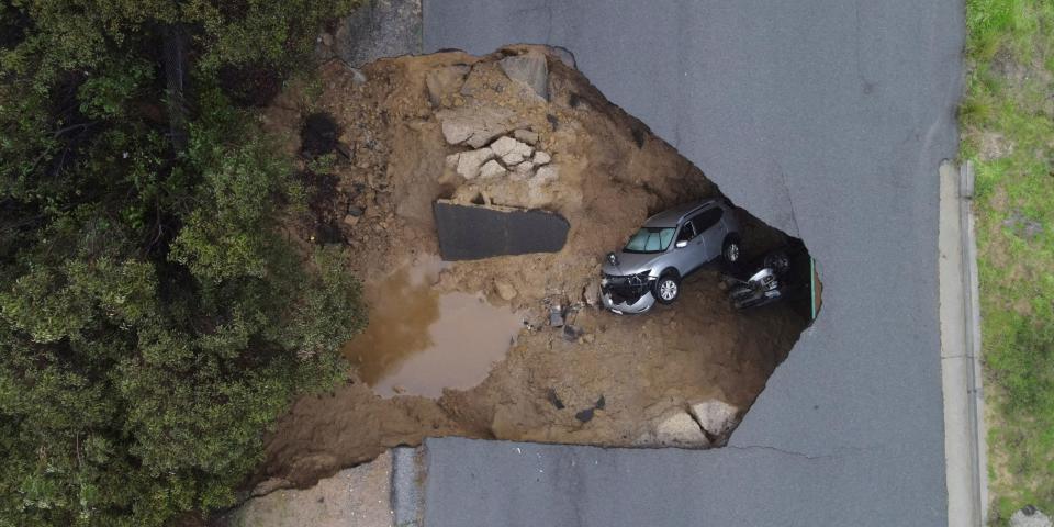 Several people had to be rescued after two vehicles fell into a sinkhole in Chatsworth, California, U.S., January 10, 2023.