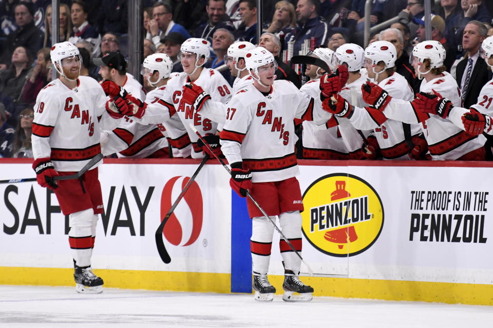 Carolina Hurricanes' Andrei Svechnikov (37) celebrates his goal against the Winnipeg Jets with teammates during second period NHL hockey action in Winnipeg, Manitoba on Tuesday Dec. 17, 2019. (Fred Greenslade/The Canadian Press via AP)