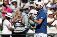 Mar 23, 2018; Key Biscayne, FL, USA; Benoit Paire of France salutes the crowd after his match against Novak Djokovic of Serbia (not pictured) on day four of the Miami Open at Tennis Center at Crandon Park. Paire won 6-3, 6-4. Mandatory Credit: Geoff Burke-USA TODAY Sports