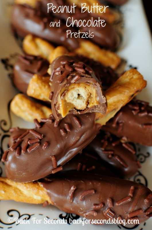 <p>Back For Seconds</p><p>Peanut Butter and Chocolate + Sweet and Salty + Easy + No Bake = WIN!!! </p><p><strong>Get the recipe: <a href="https://backforseconds.com/peanut-butter-chocolate-pretzels/" rel="nofollow noopener" target="_blank" data-ylk="slk:Peanut Butter Chocolate Pretzels;elm:context_link;itc:0;sec:content-canvas" class="link rapid-noclick-resp">Peanut Butter Chocolate Pretzels</a></strong></p>