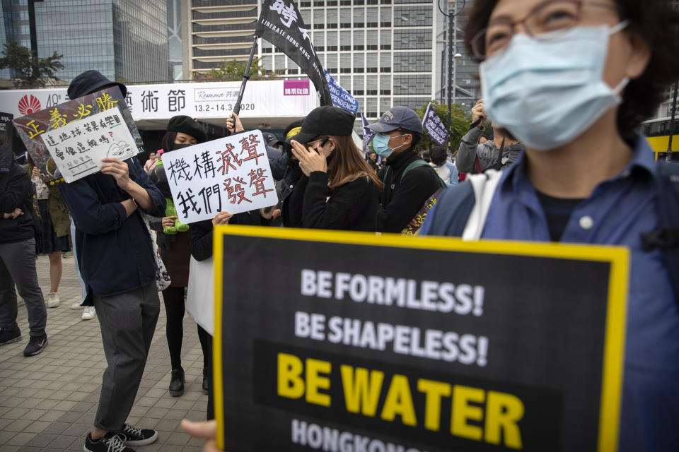 Protesters gather during a rally in Hong Kong, Sunday, Dec. 15, 2019. Hong Kong police said on Saturday that they have arrested three men for testing homemade explosives they suspect were intended for use during protests. (AP Photo/Mark Schiefelbein)